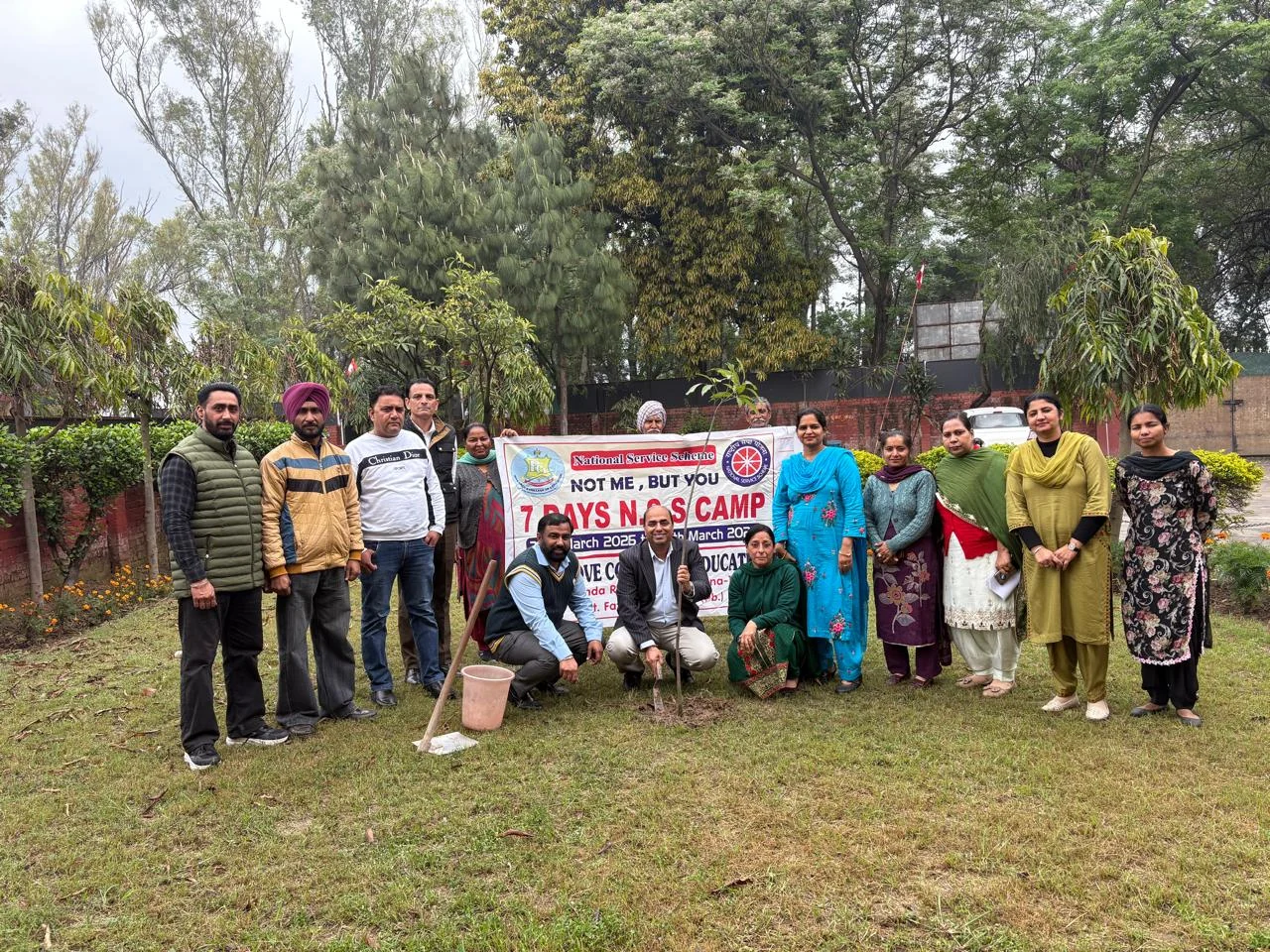Participants and staff gathered beside a newly planted sapling during the Pine Grove College of Education seven-day NSS camp on 20 March 2026.