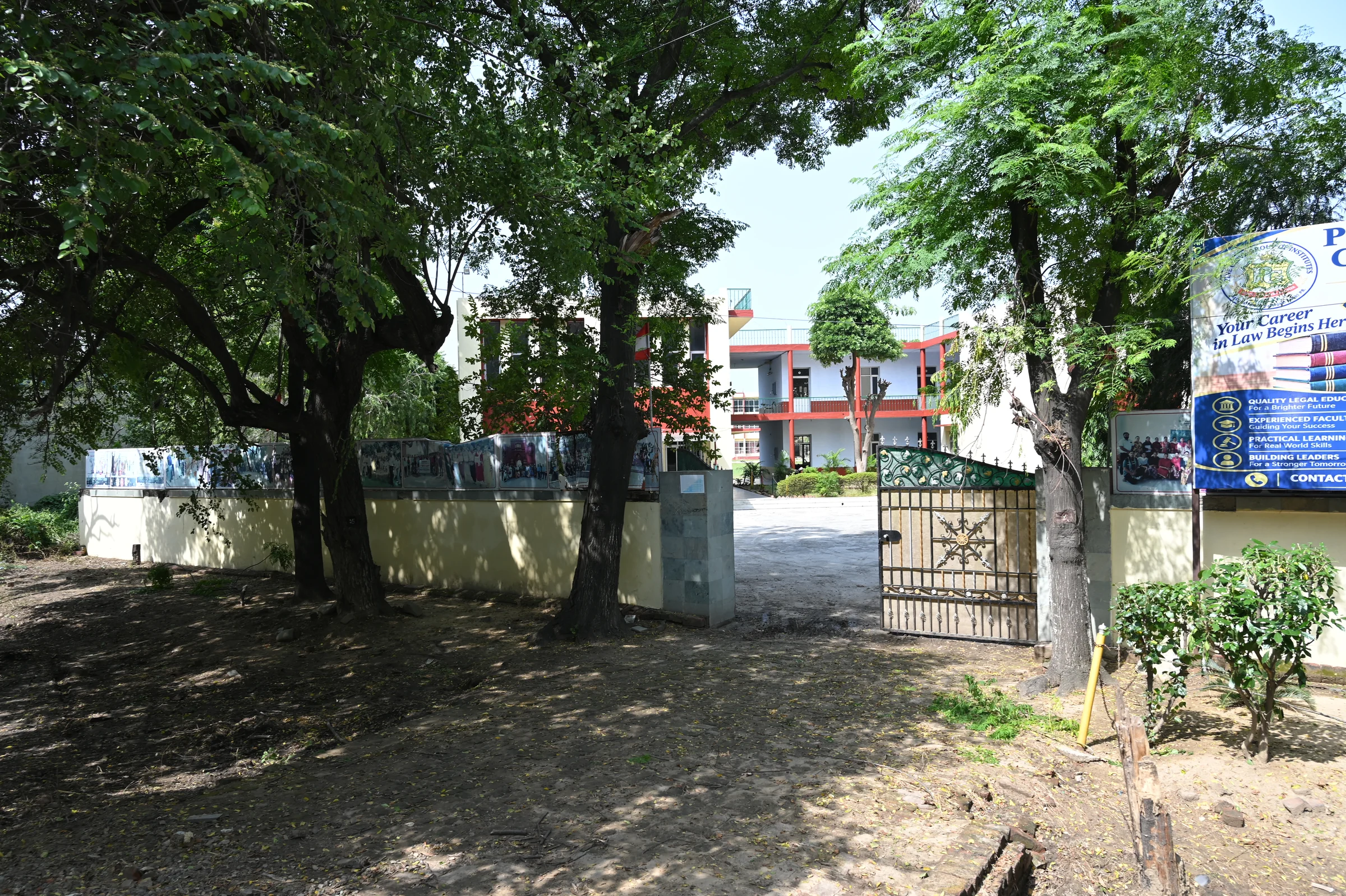 The college entrance with an academic block visible beyond the gateway.