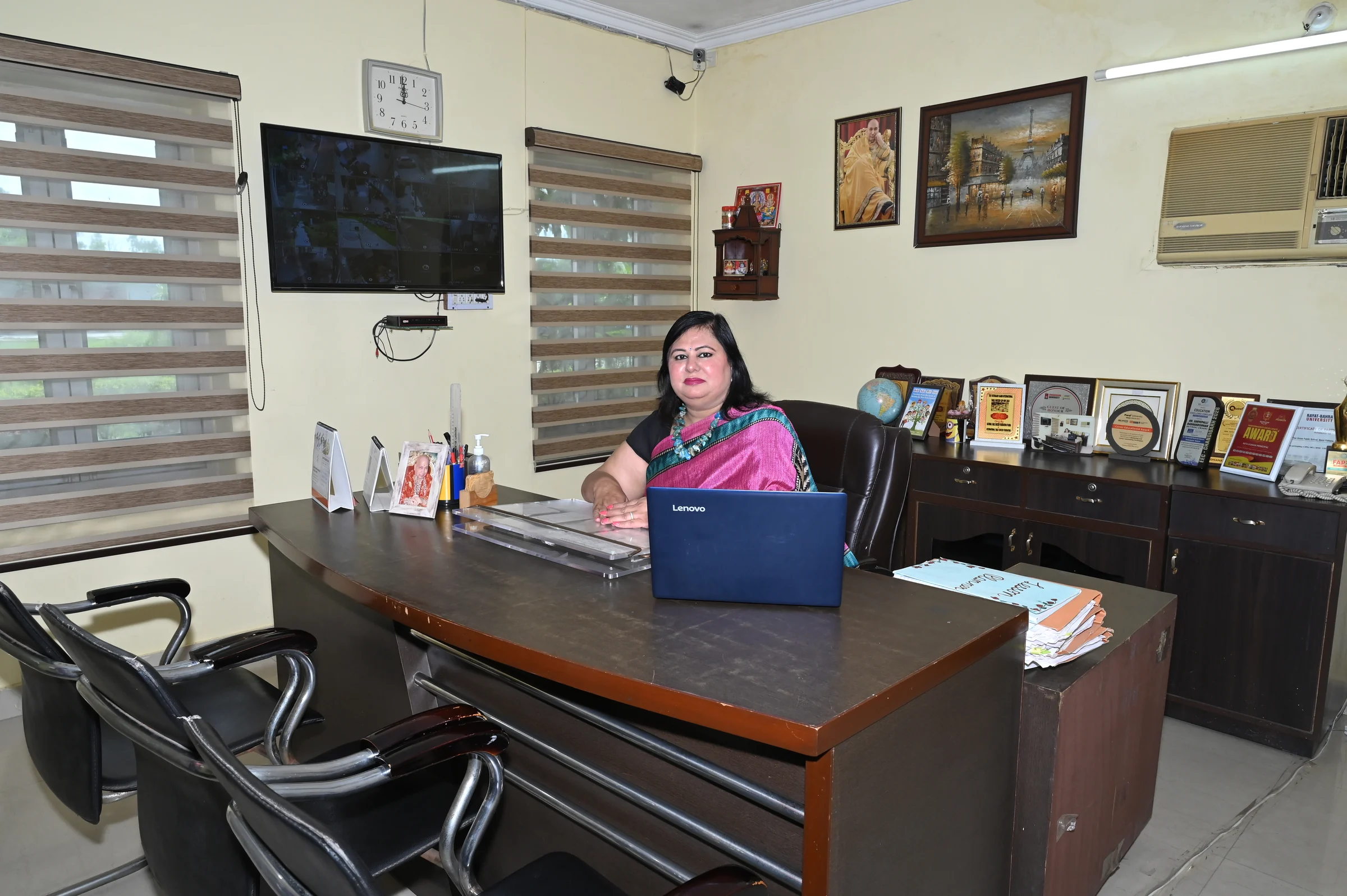 A current portrait of the Pine Grove Public School principal at her office desk.