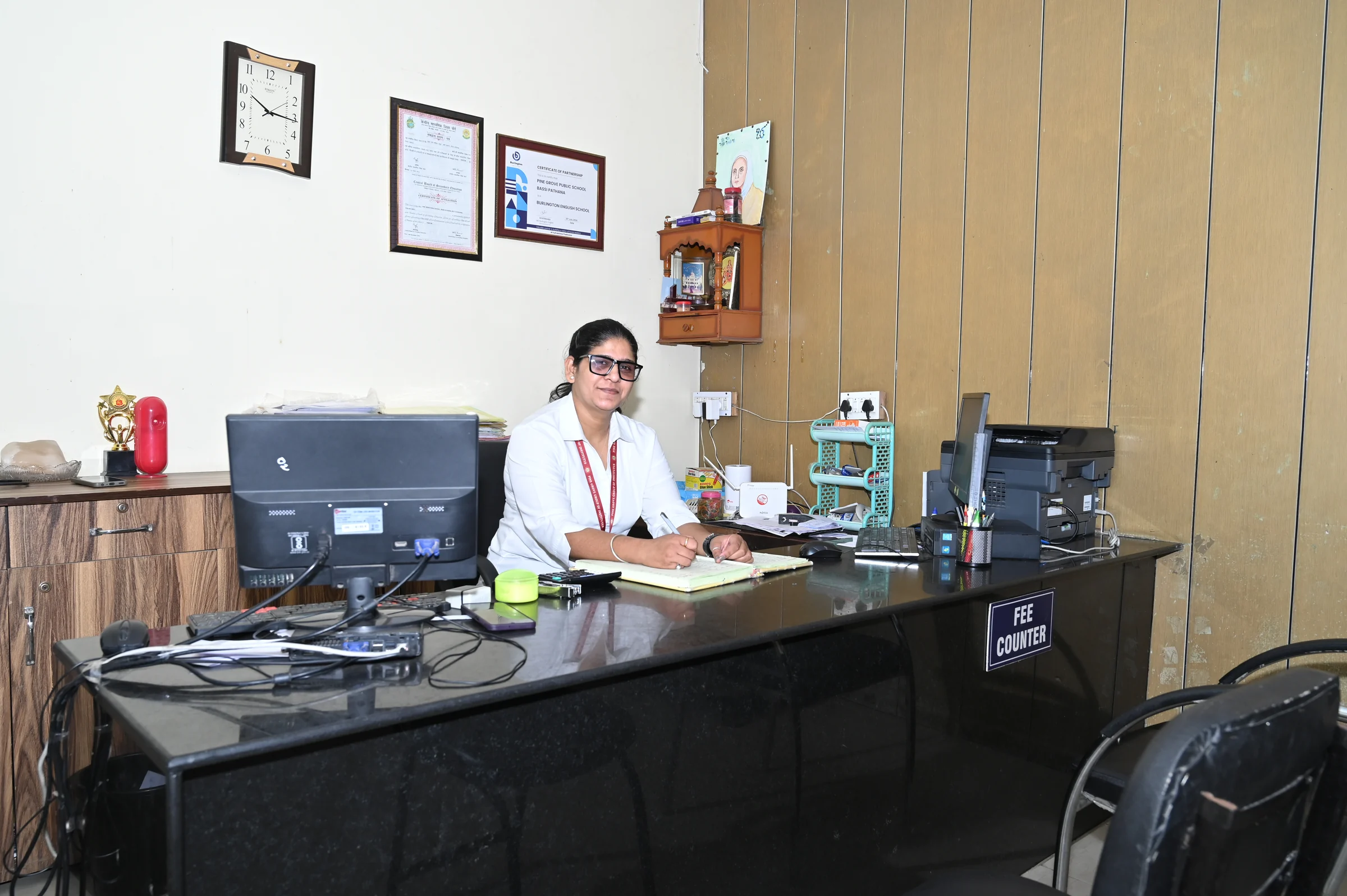 The receptionist at her desk in the Pine Grove Public School reception office.